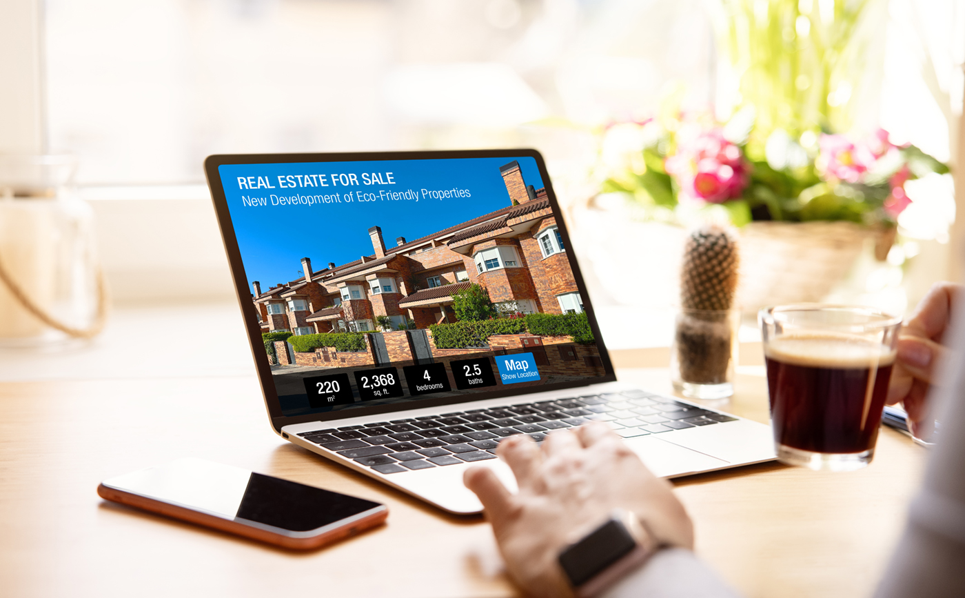 Real estate agent website shown on a laptop and phone